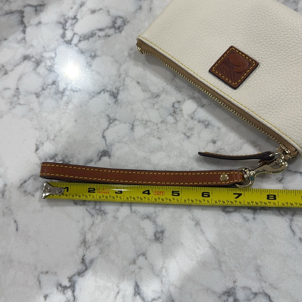 ￼New without tag Dooney and Bourke large wristlet wallet. Creamy white. - Picture 9 of 9